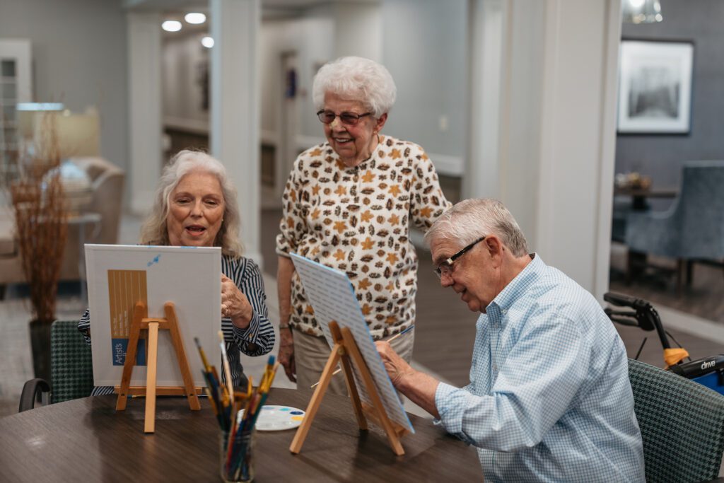 Residents engaged in a painting activity.