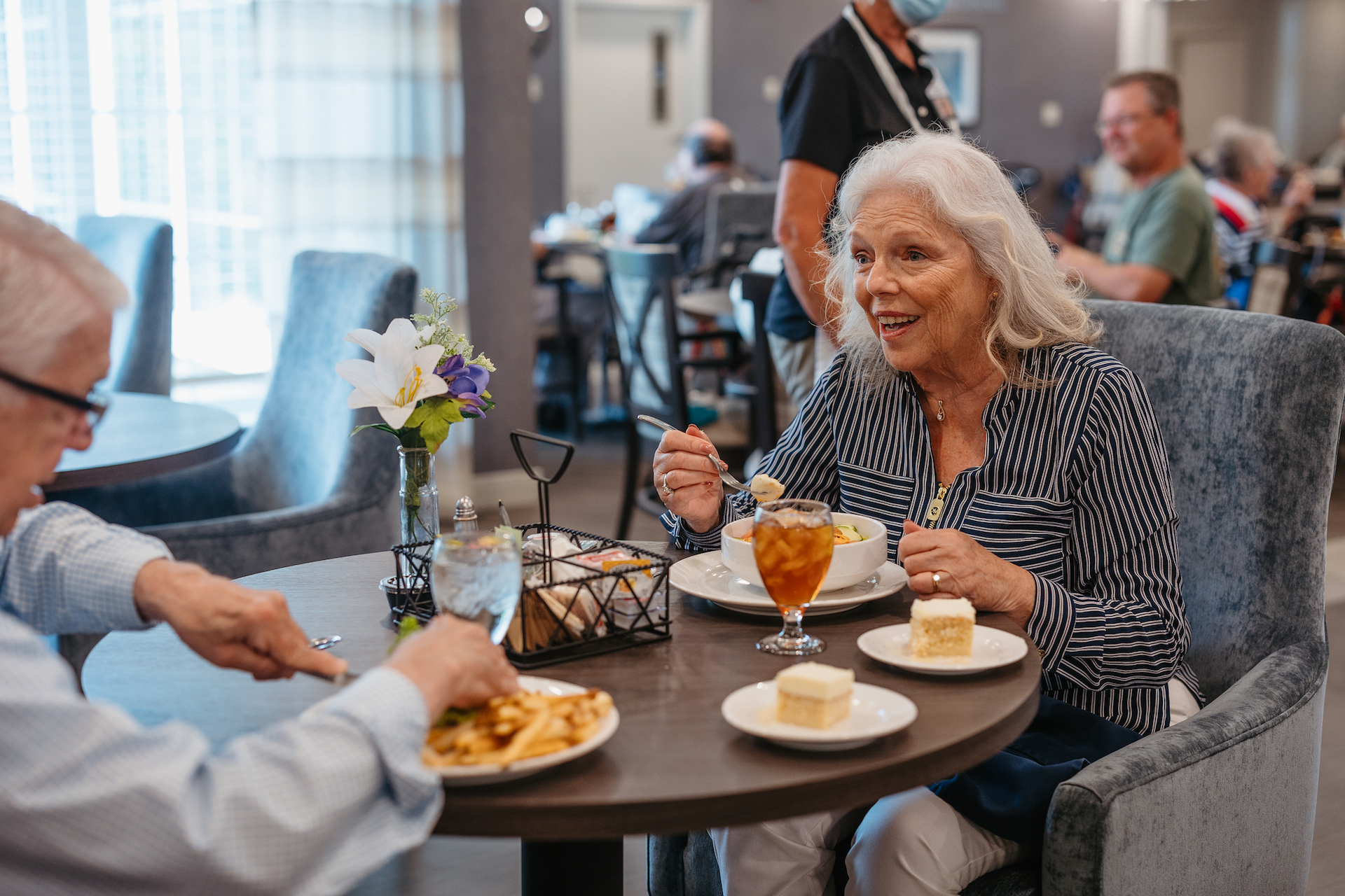 Residents enjoying a meal in the dining area.