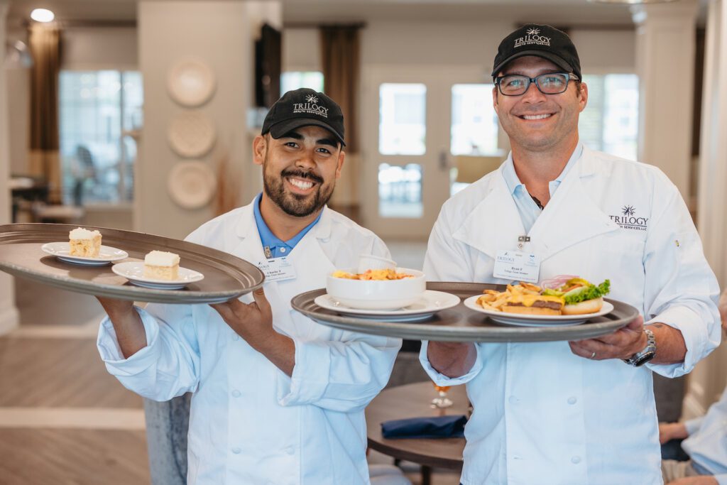 Chefs presenting meals in a dining area