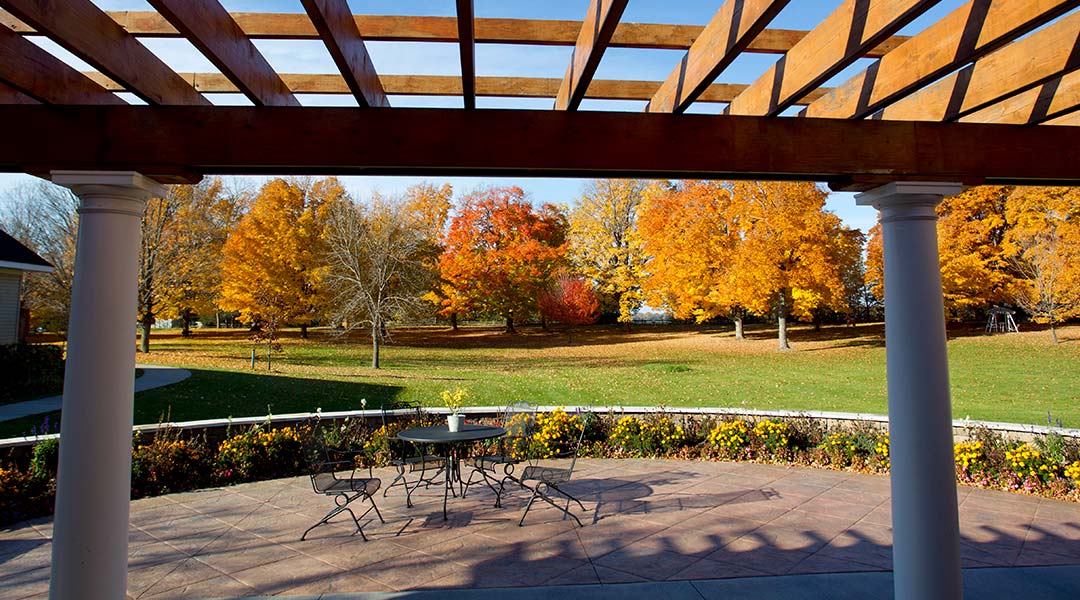 Outdoor patio with colorful autumn trees