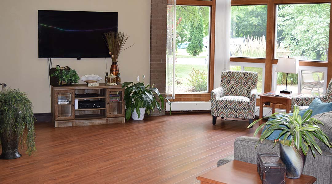 Bright and welcoming interior common area with seating.