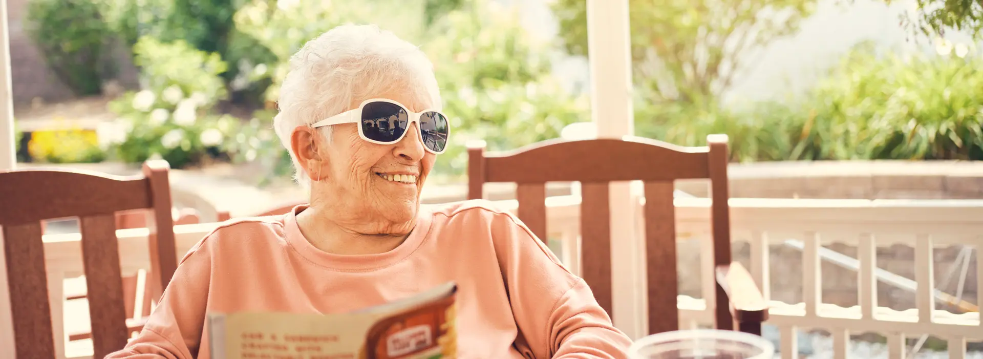 Senior woman enjoying time outdoors in sunglasses.