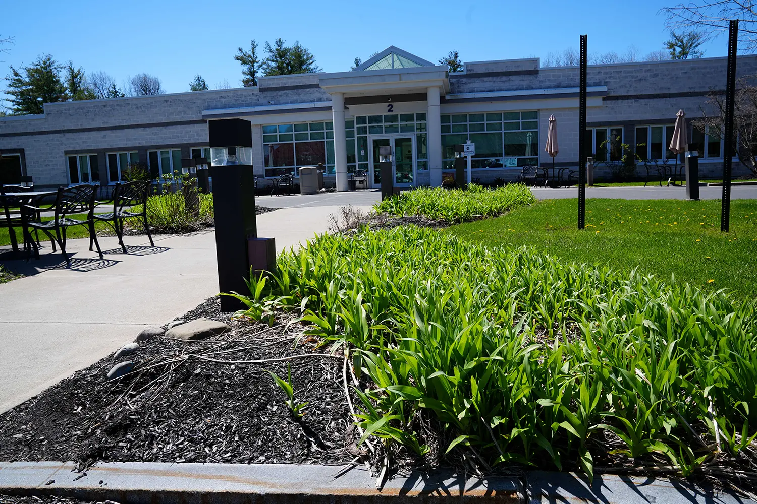 Well-maintained outdoor garden space in front of the facility.