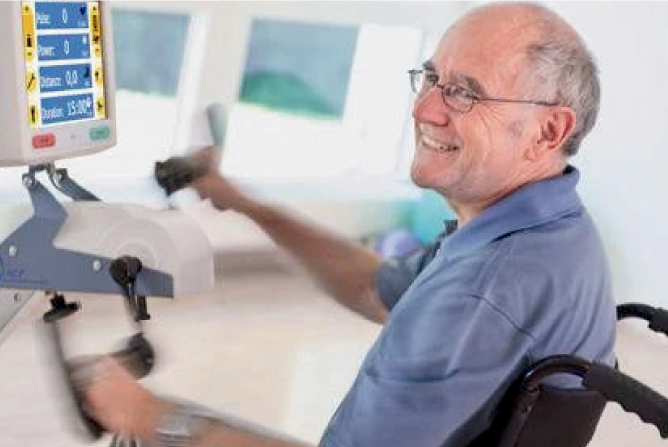 Senior man using exercise equipment in therapy.