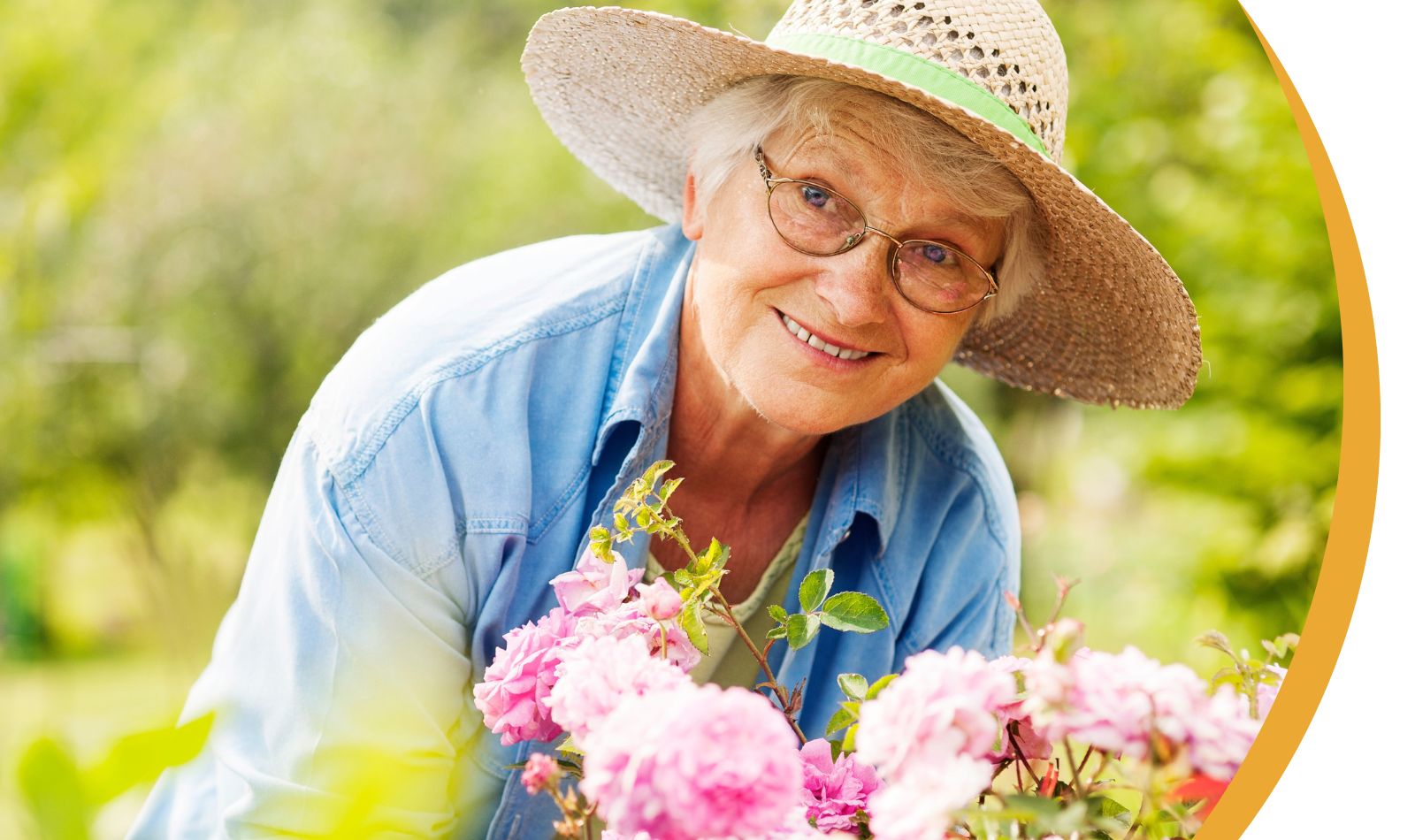 Senior woman tending to flowers in a garden.