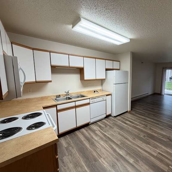 Well-equipped kitchen area in a resident unit.