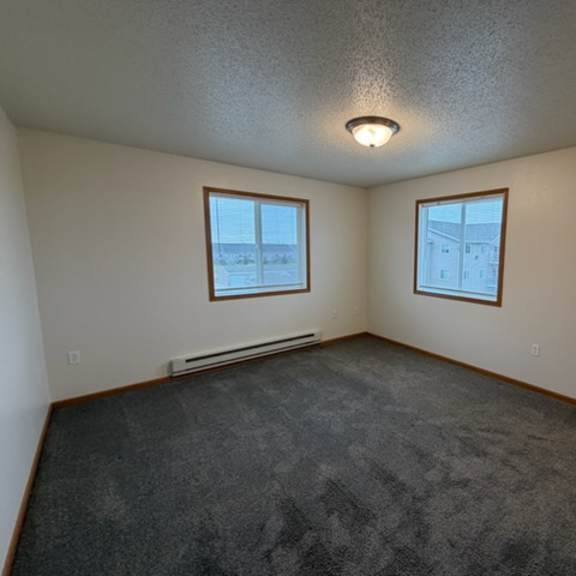 Empty resident room with two windows