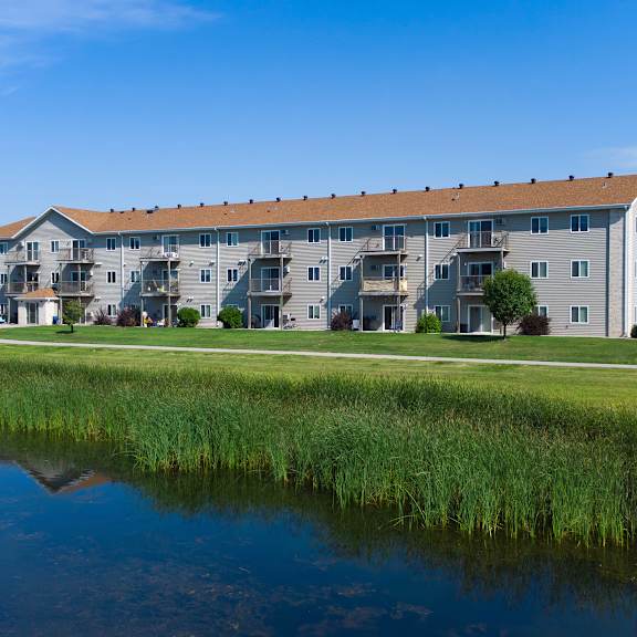 Exterior view of a multi-story assisted living building.