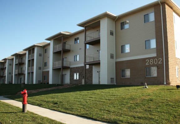Exterior view of the building with lawn.