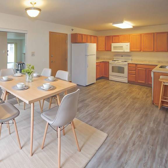 Bright, modern kitchen with dining table.