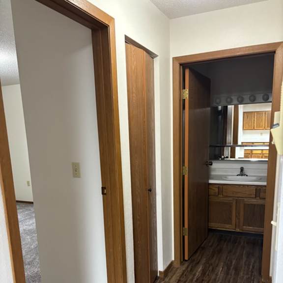 Interior hallway leading to bathroom and kitchen