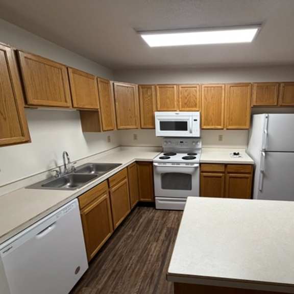 Clean kitchen area with modern appliances.