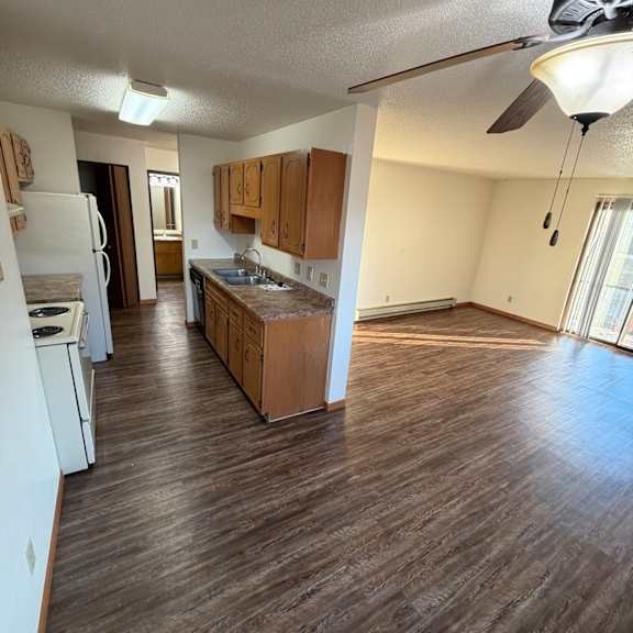 Spacious kitchen and living area in a resident unit.