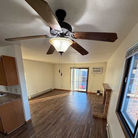 Bright living area with a ceiling fan
