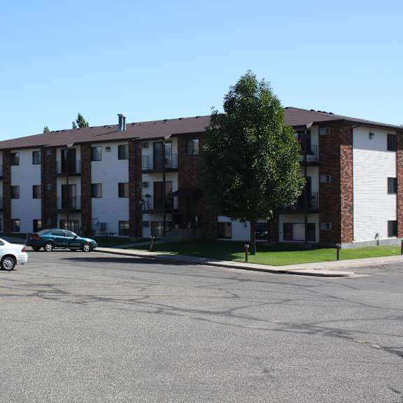 Exterior view of a residential building with landscaping.