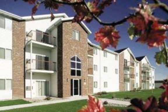 Exterior view of Cooperative Living Center with landscaping.