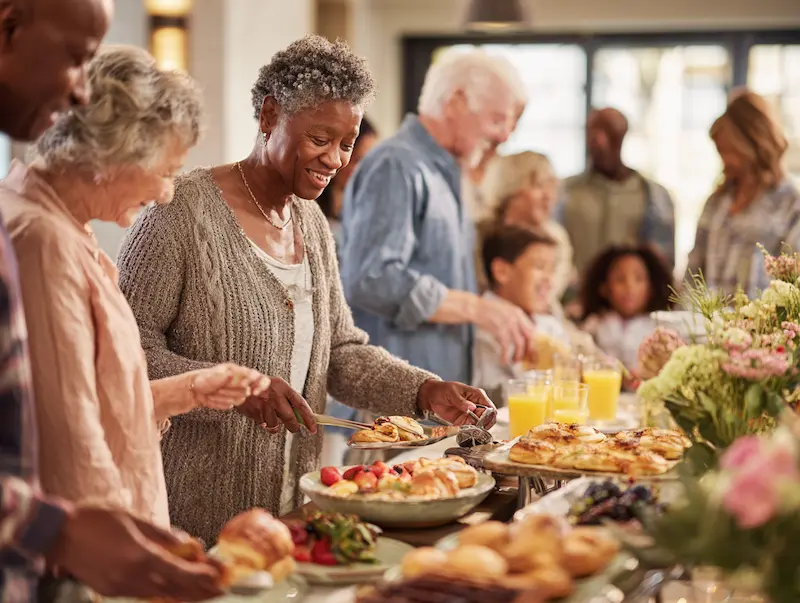 Residents enjoying a meal together in a common area