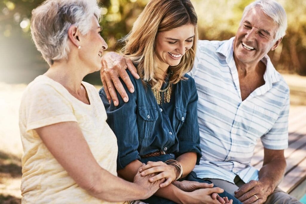 Seniors and a caregiver enjoying time outdoors