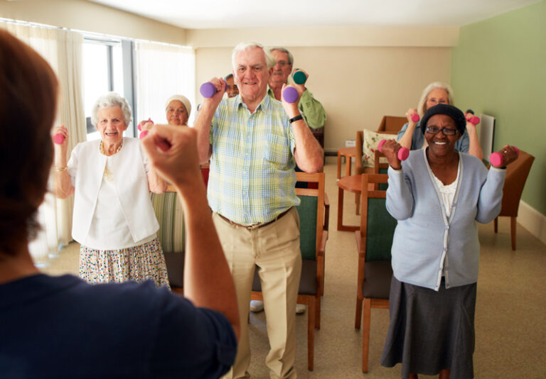Seniors participating in a group exercise class.
