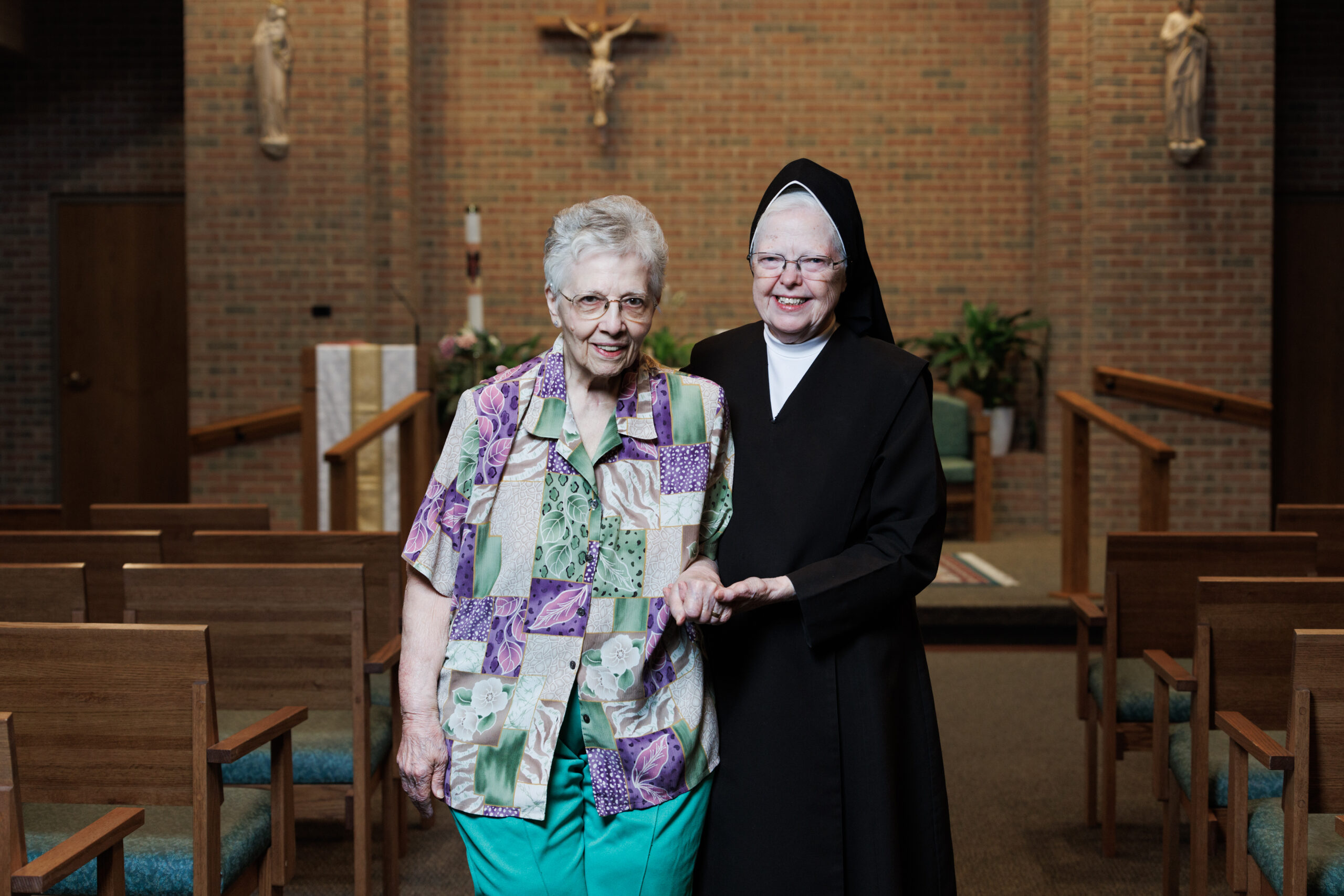 Resident and staff member in the chapel