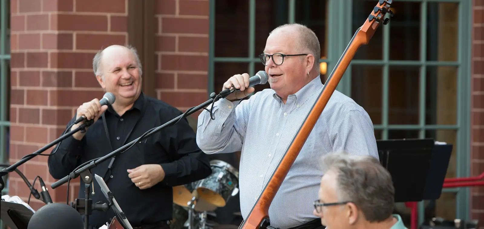 Live music performance outdoors with two singers