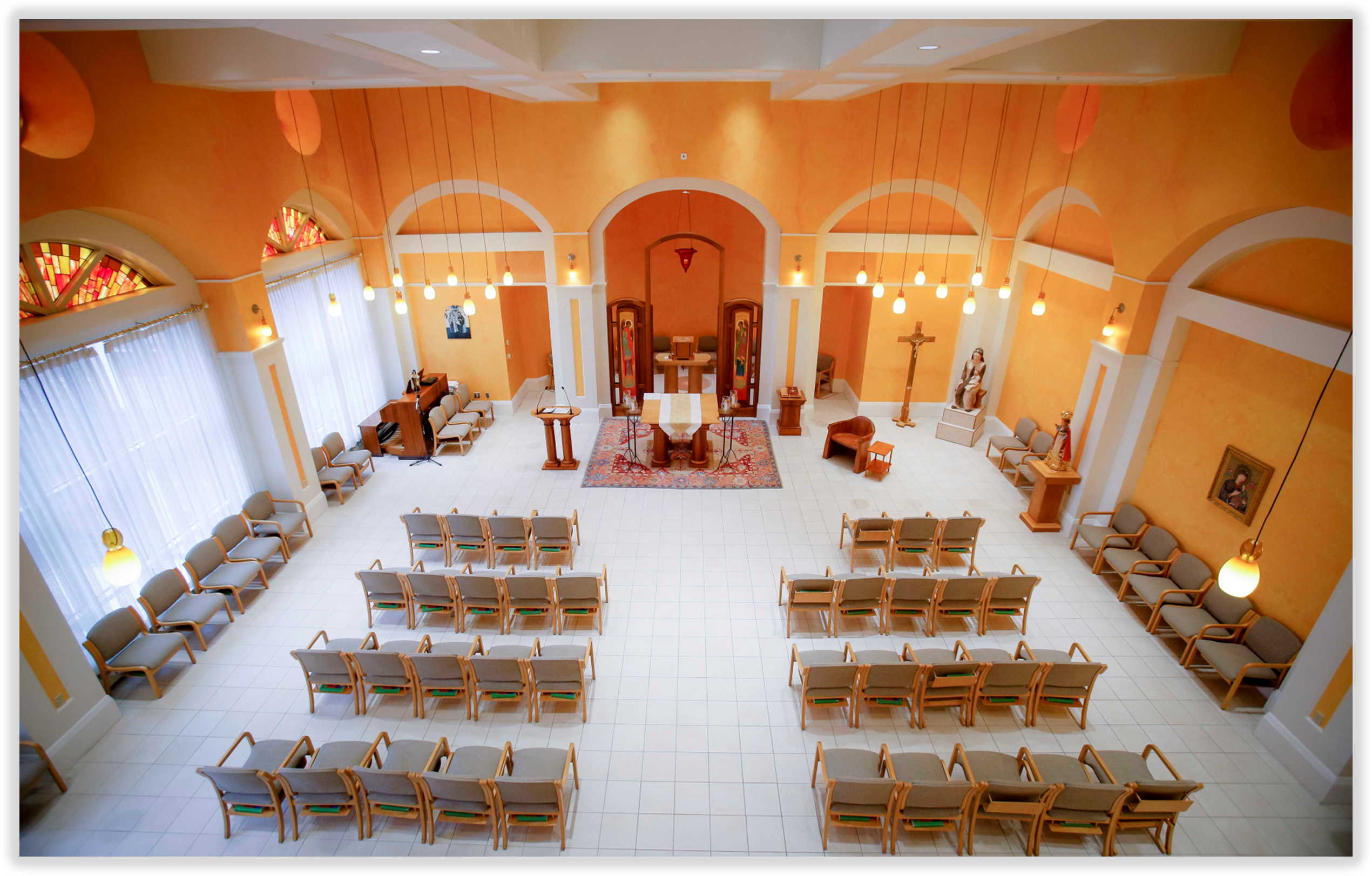 Spacious interior of a chapel with seating.
