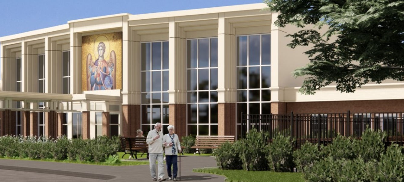 Two residents walking by the facility's exterior.