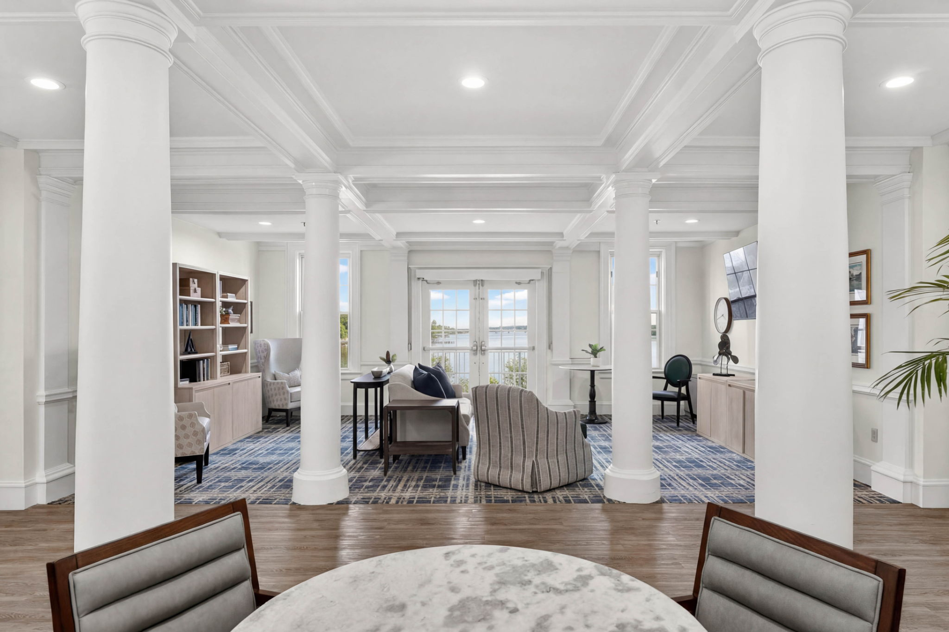 Bright common area with seating and bookshelves
