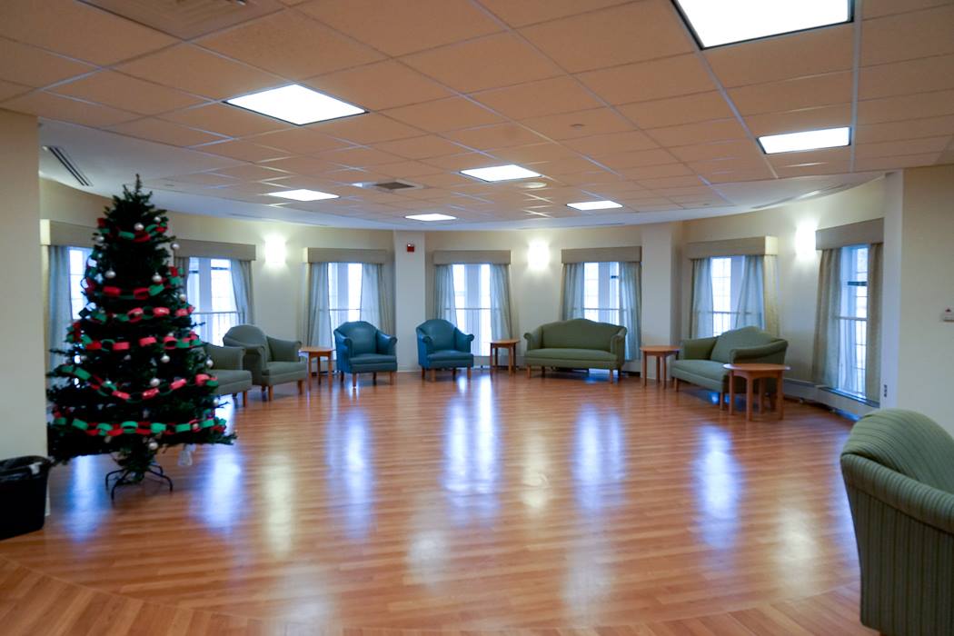 Bright common area with Christmas tree and seating