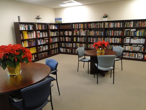 Interior of a library with bookshelves and tables