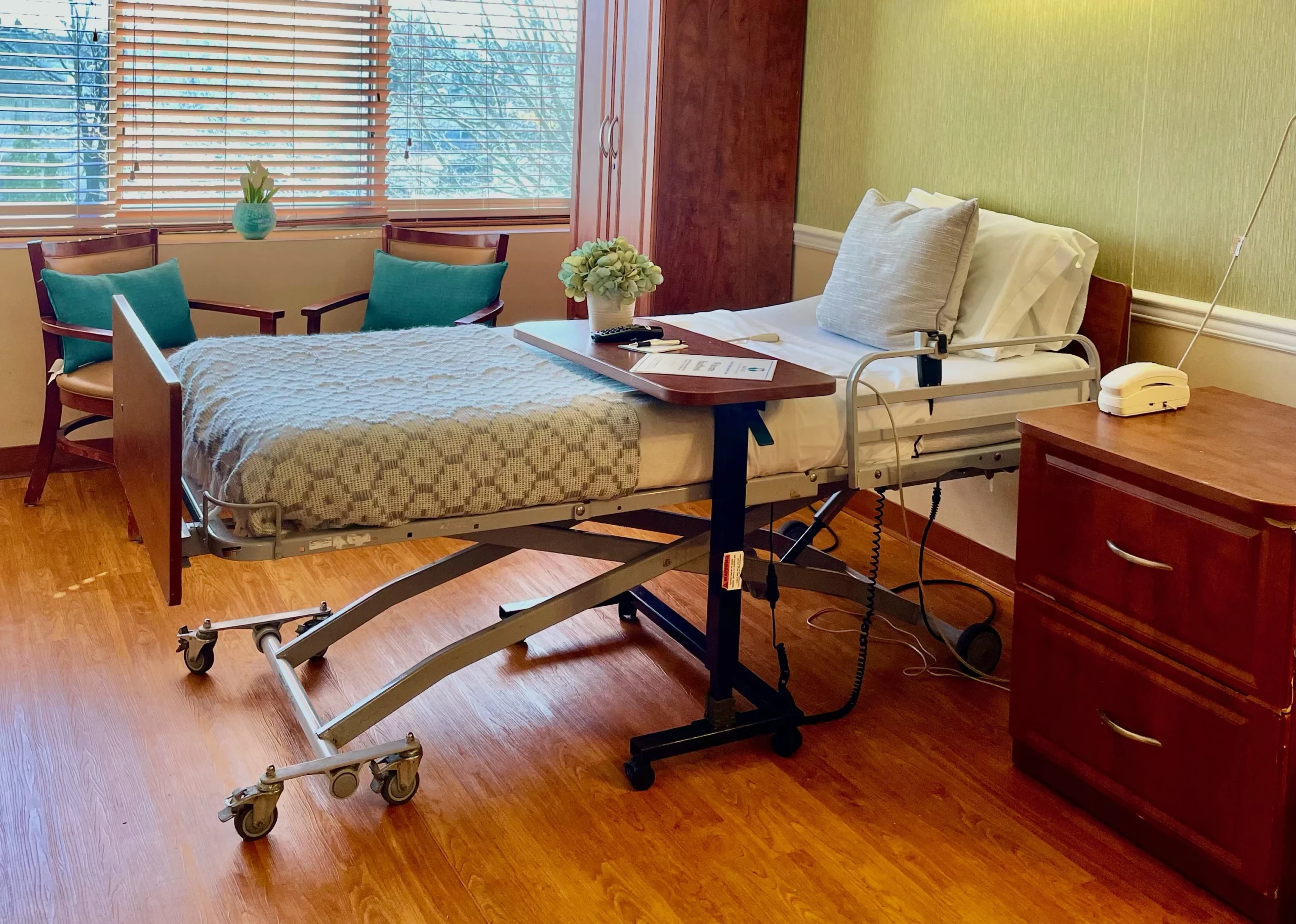 An interior view of a resident's room with a hospital bed