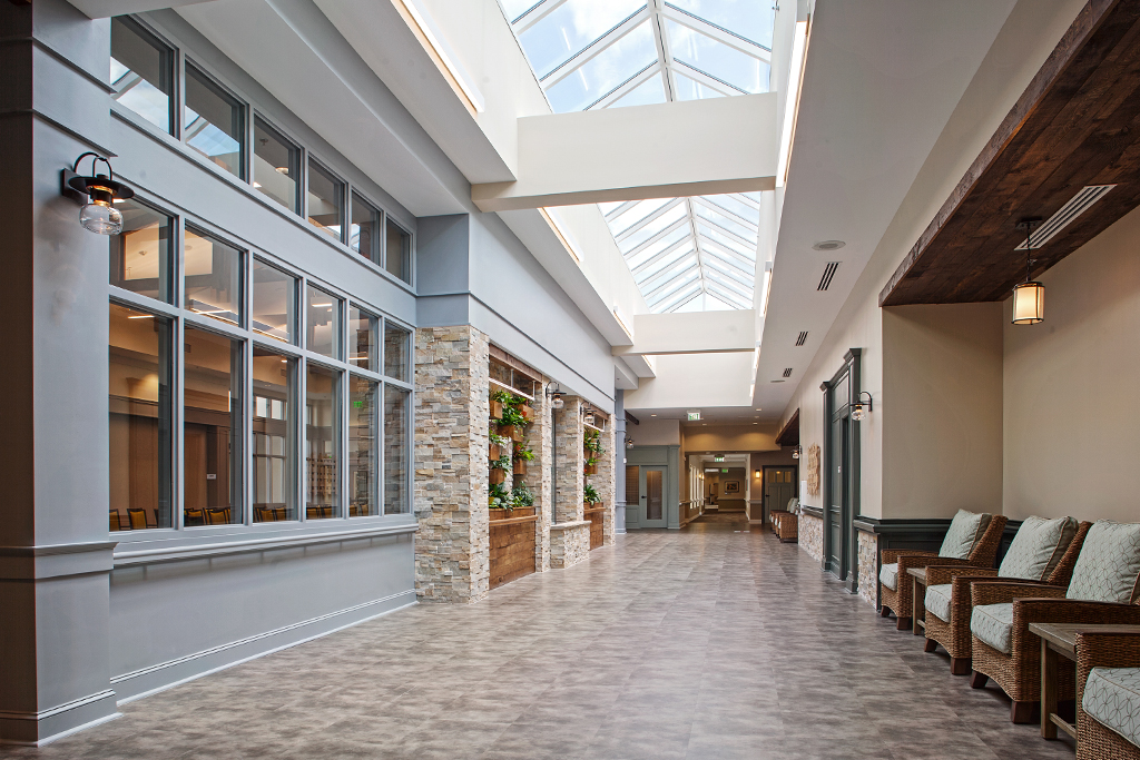 Bright interior corridor with seating and natural light