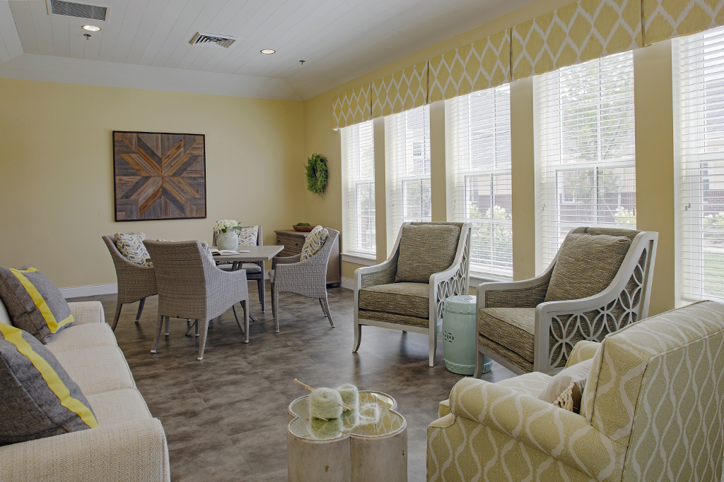 Bright common area with cozy seating and natural light