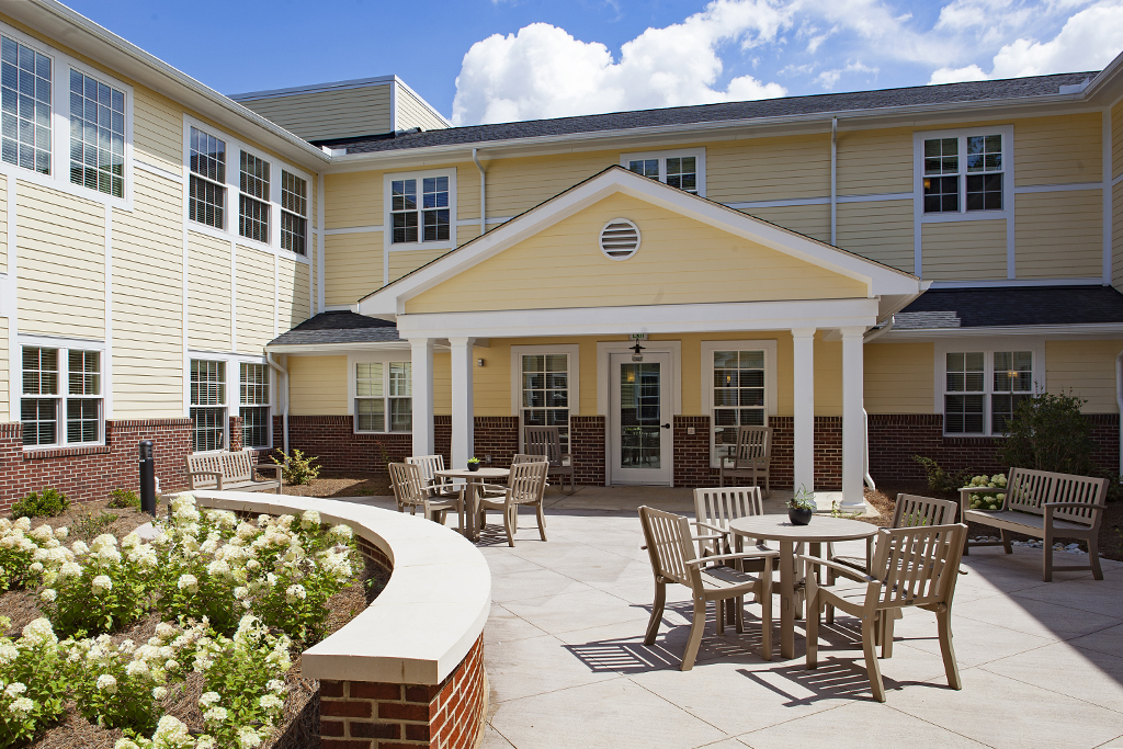 Outdoor patio area with seating and landscaping