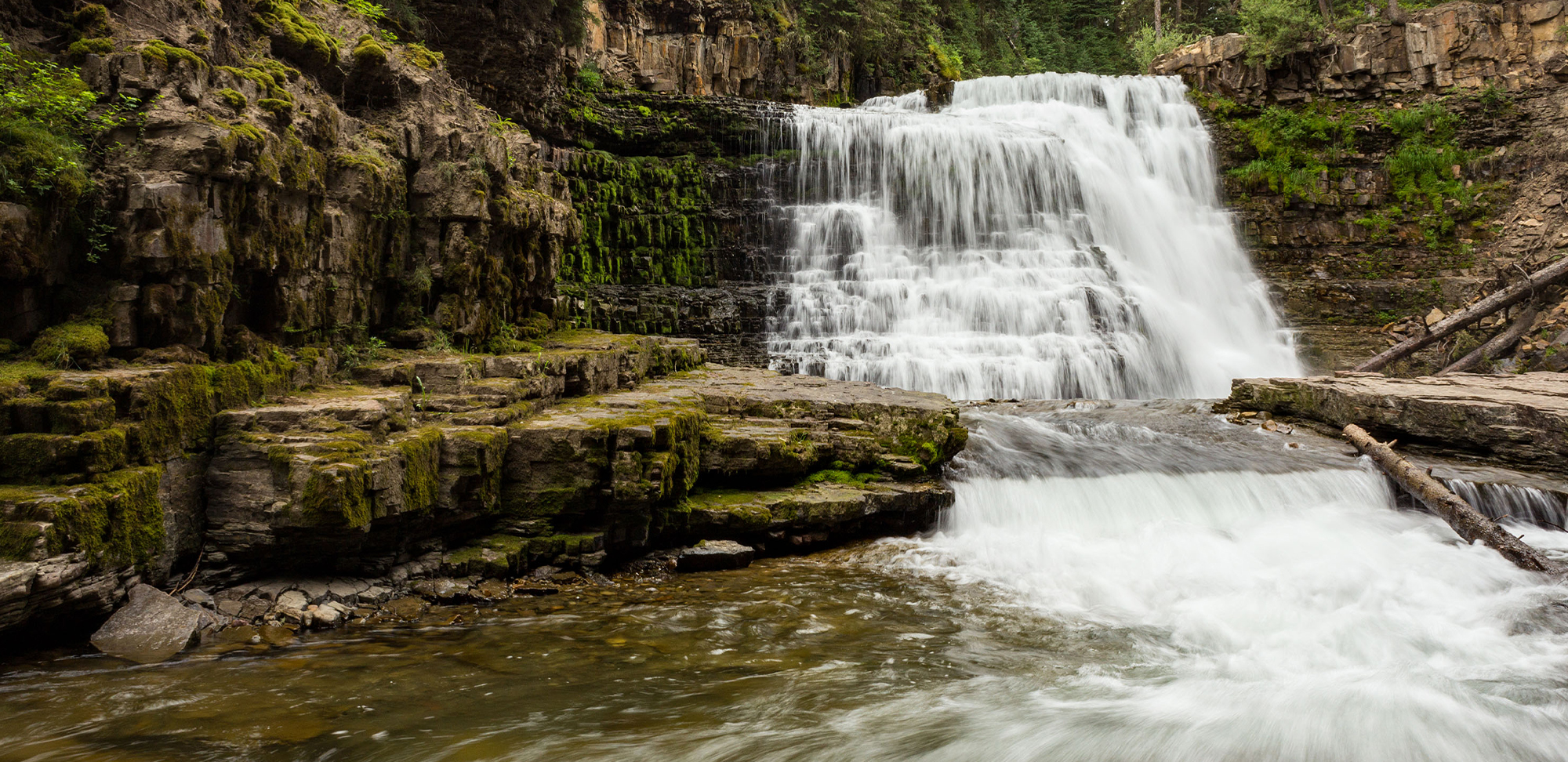 A serene waterfall surrounded by rocky terrain