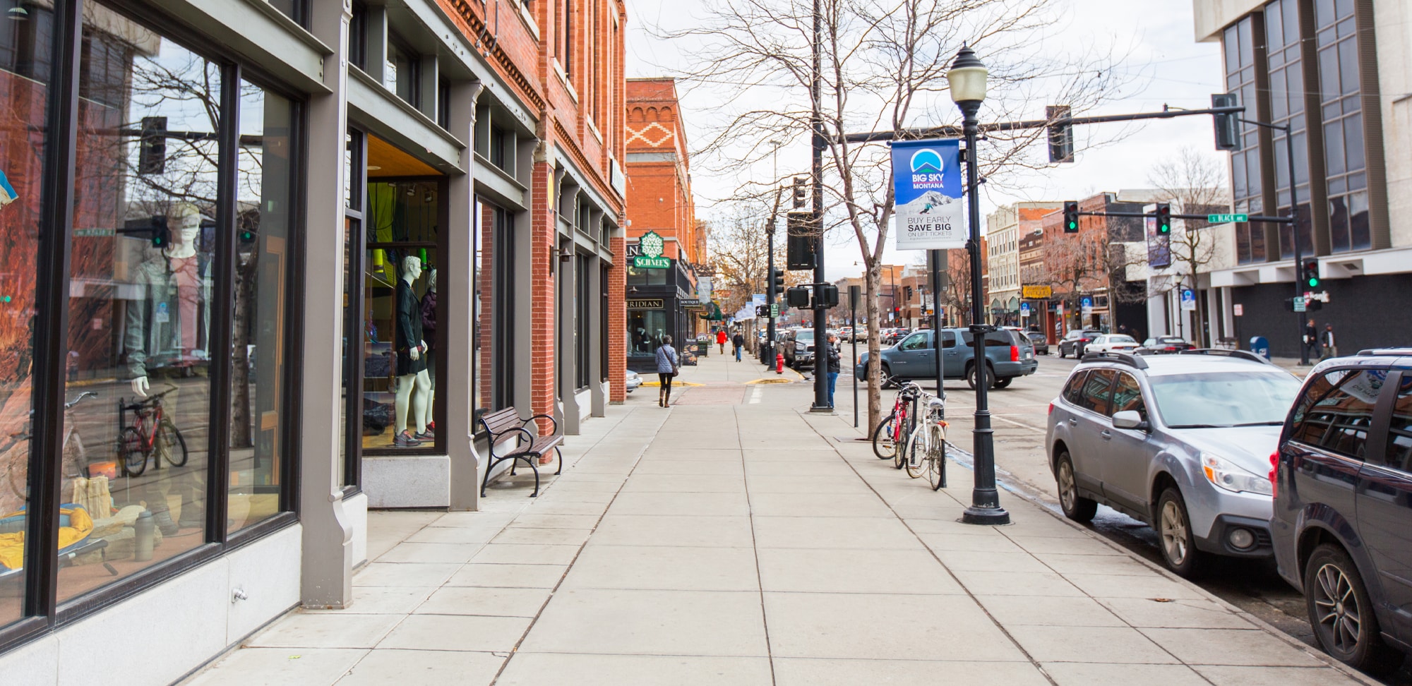 A busy city street with shops and pedestrians