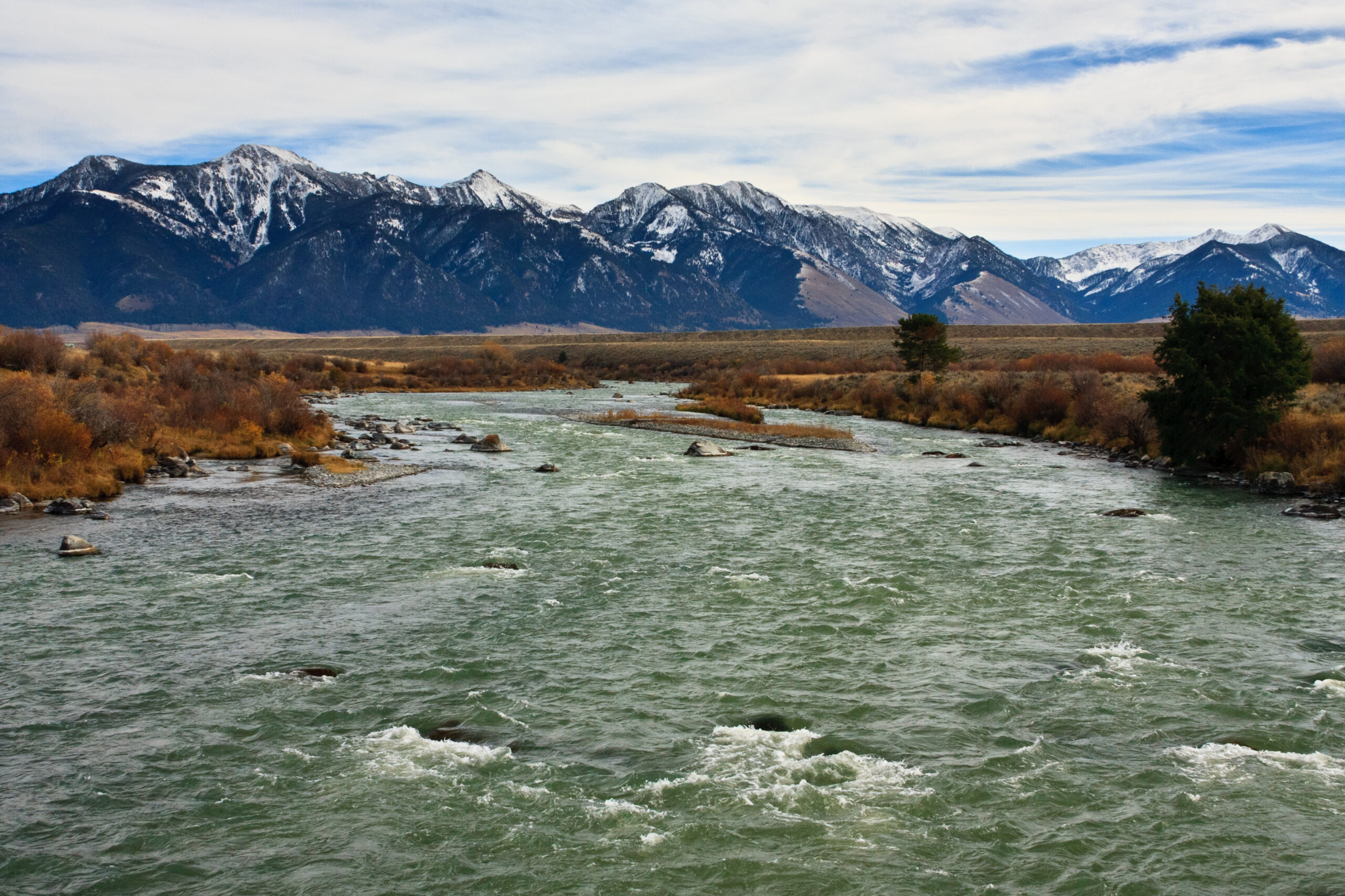 Scenic view of a river with mountains in the background