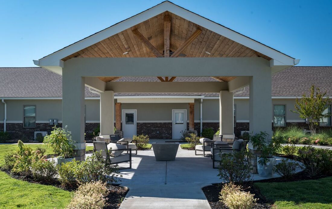 Outdoor gathering space with seating and landscaping