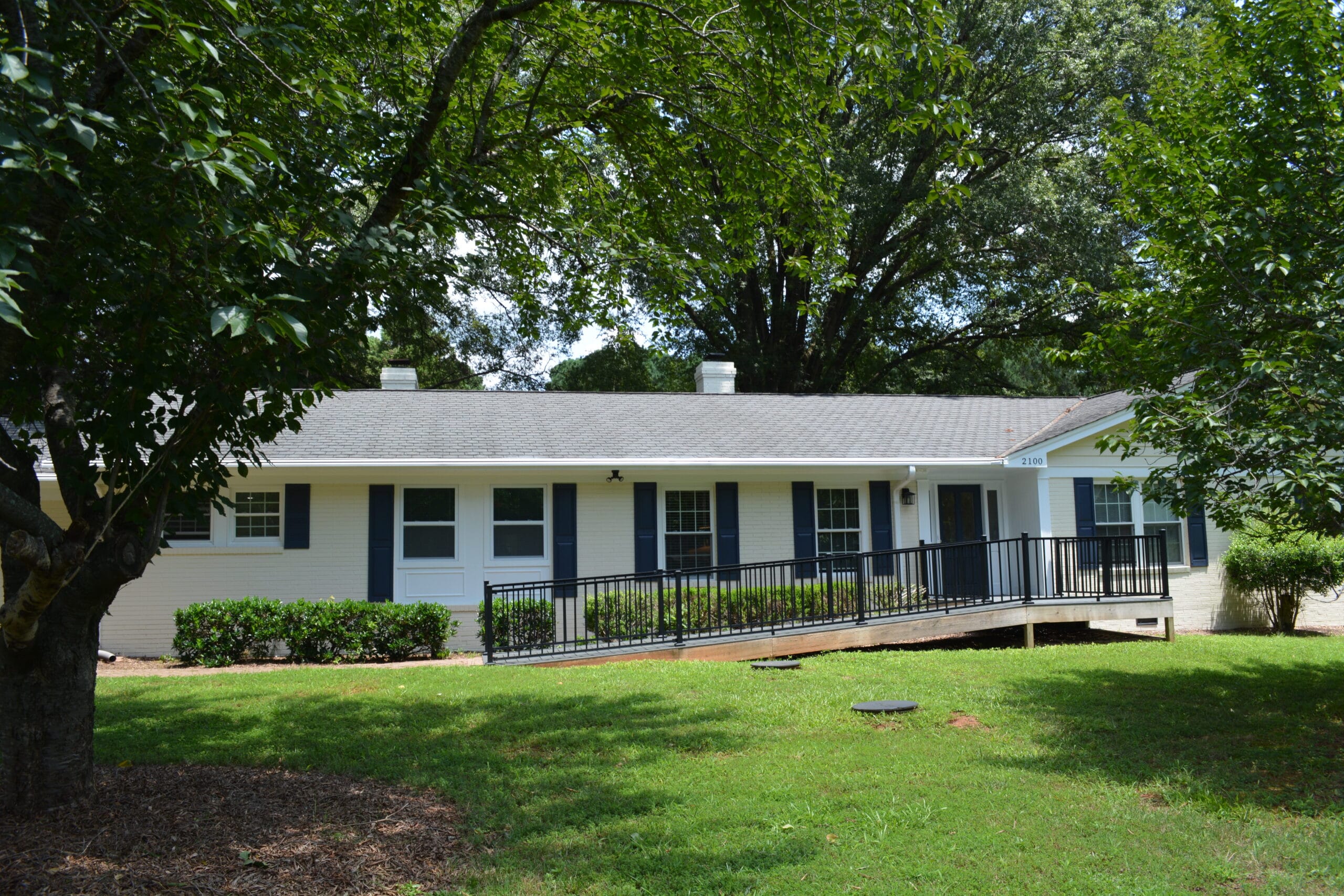 Exterior view of the facility with green lawn