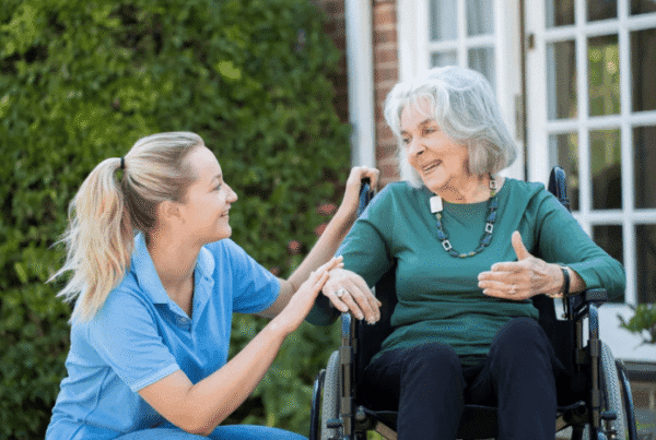 Caregiver engaging with a resident outdoors