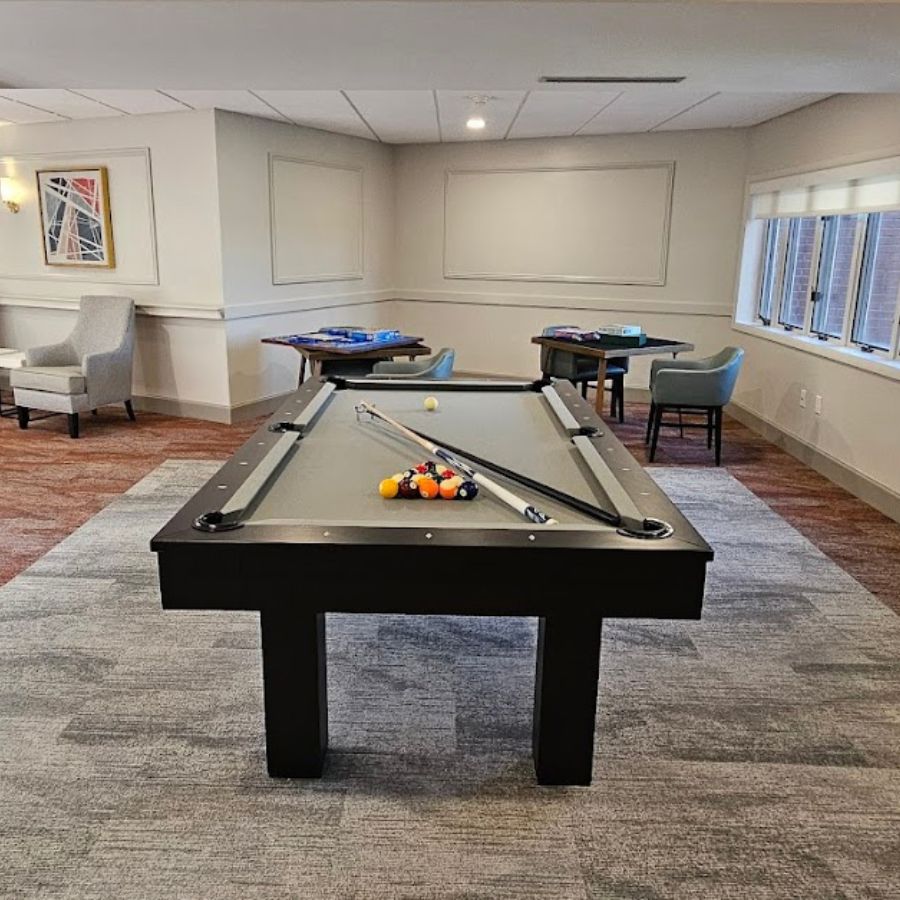 Interior game room with a pool table