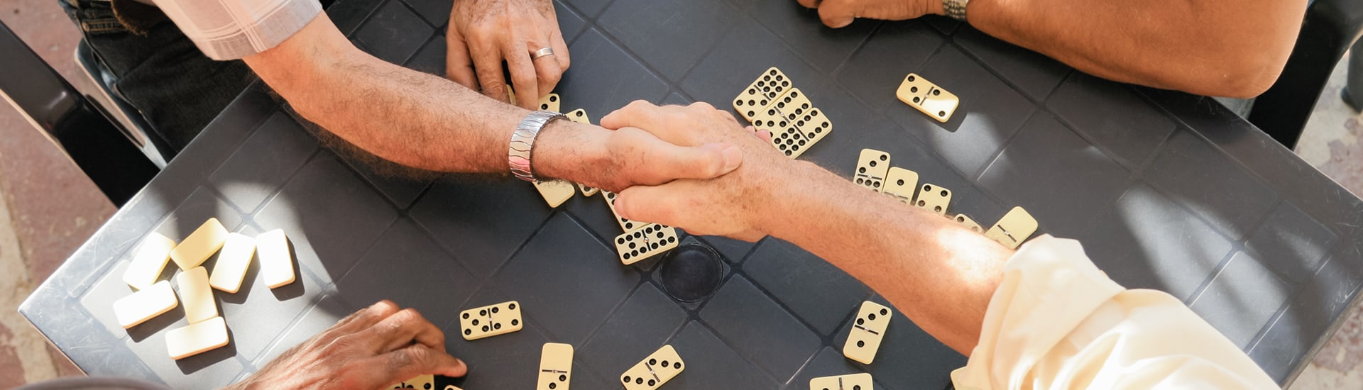 Residents engaged in a game of dominoes