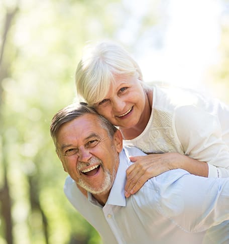 Happy elderly couple enjoying time outdoors