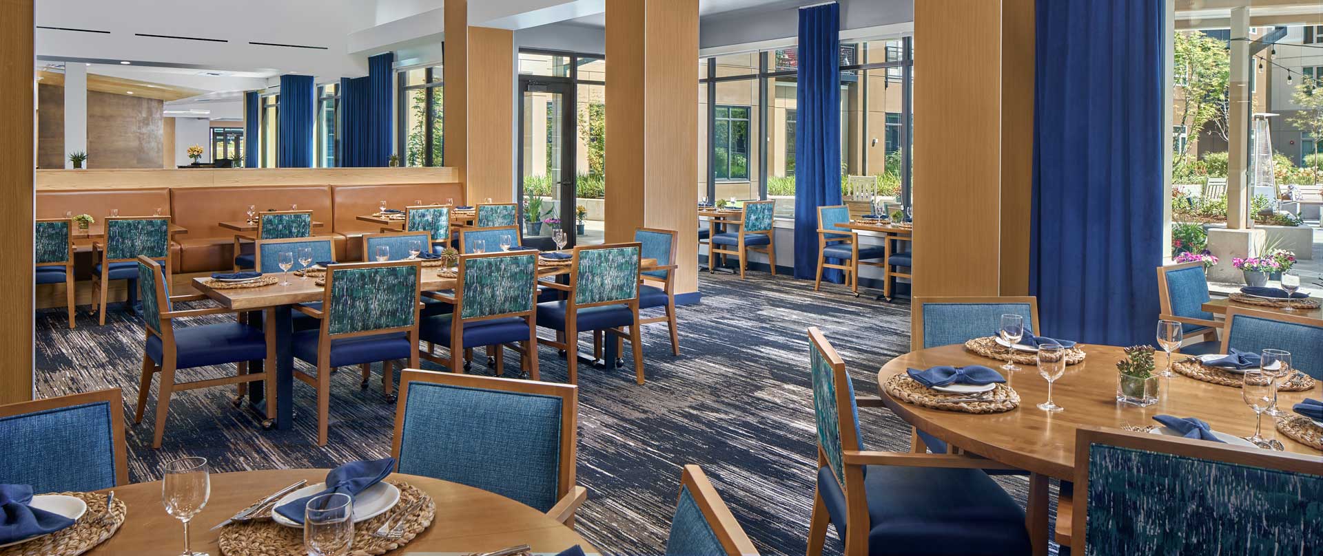 Dining room with tables set for residents