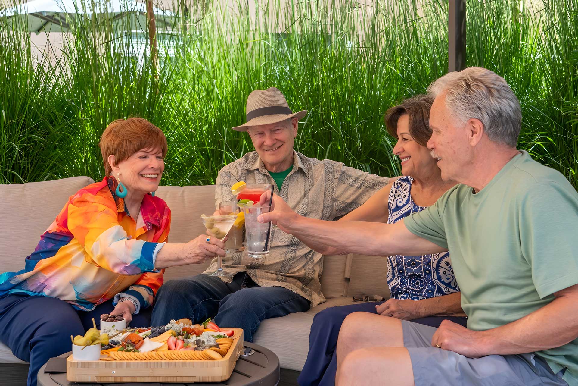 Residents enjoying a meal and drinks outdoors