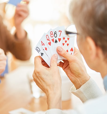 Residents playing cards in a communal area