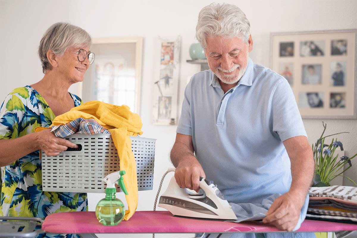 Residents engaged in an activity of ironing clothes