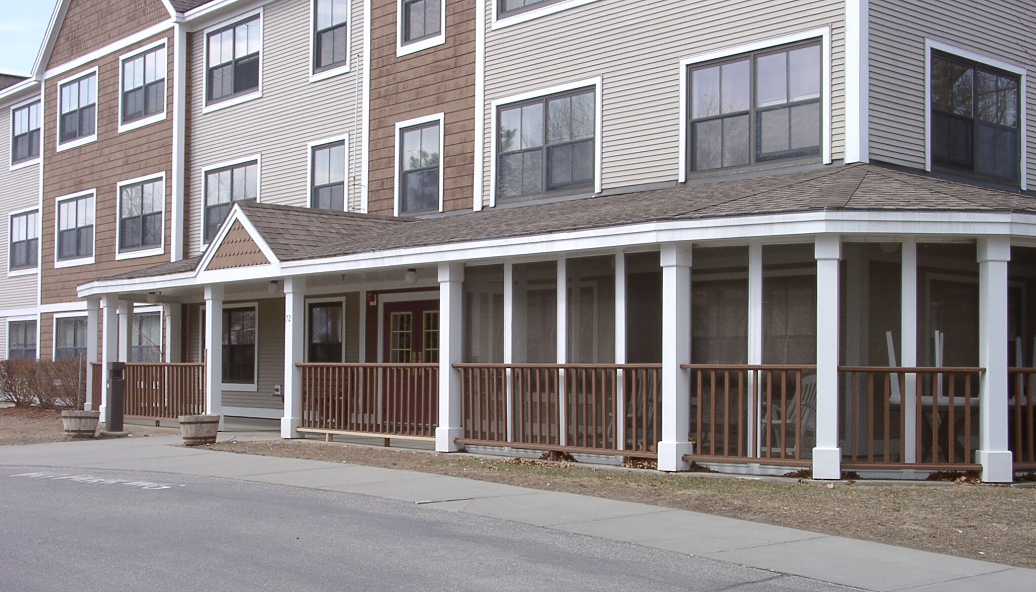 Exterior view of a senior living facility with porch