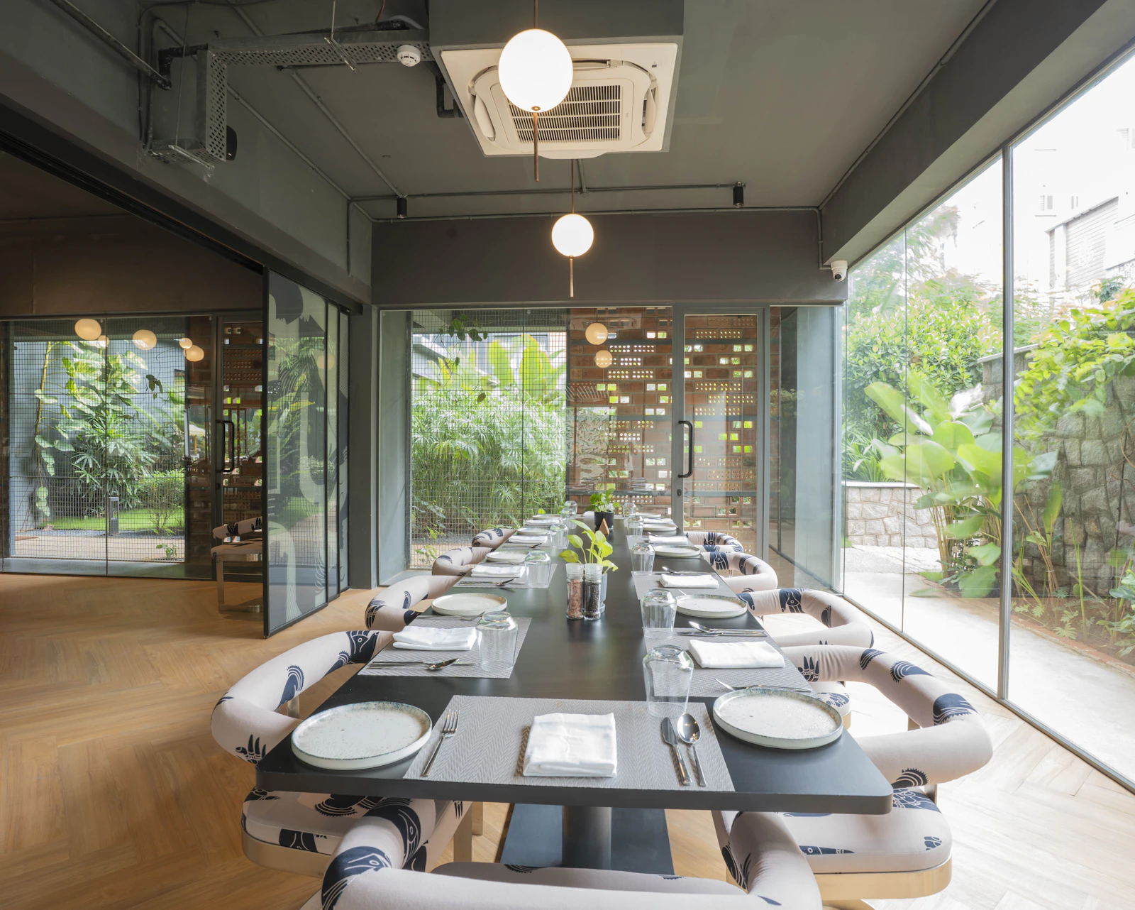 Bright dining area with greenery visible outside