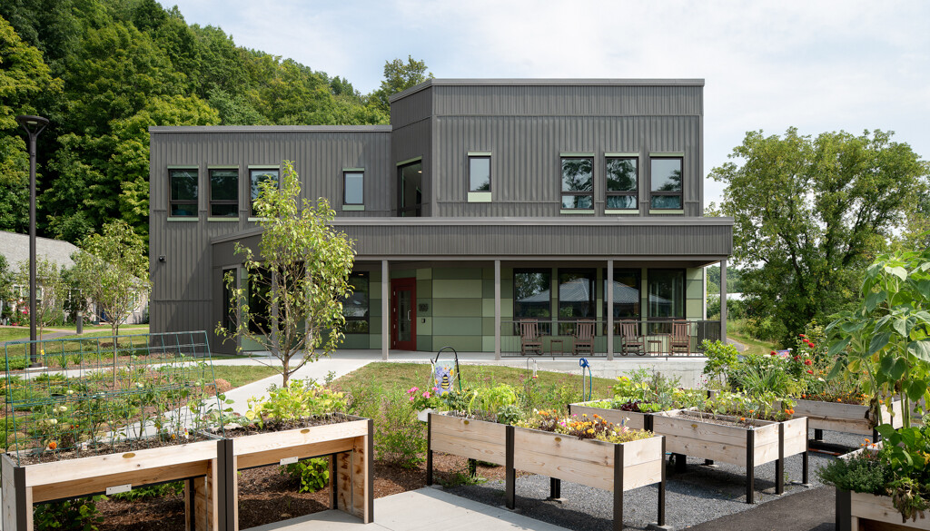 Exterior view of a modern assisted living facility with gardens